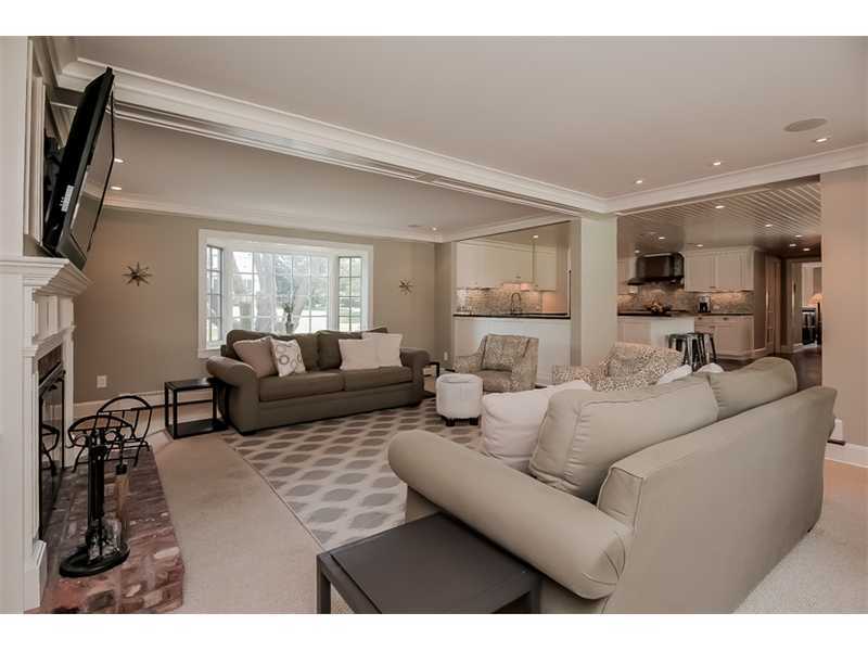 20 Beach Drive Darien, CT 06820 - Photo 12 of 25 a living room with furniture and a flat screen tv