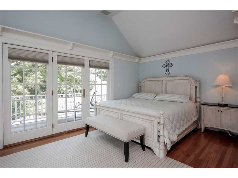 20 Beach Drive Darien, CT 06820 - Photo 14 of 25 a bed room with a bed window and a chair