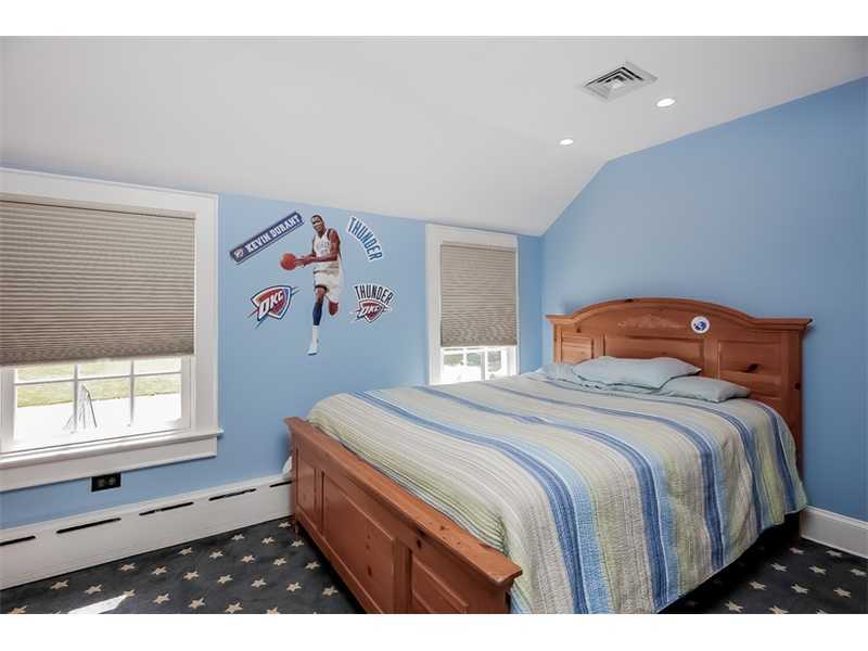 20 Beach Drive Darien, CT 06820 - Photo 18 of 25 a bedroom with a bed and a window