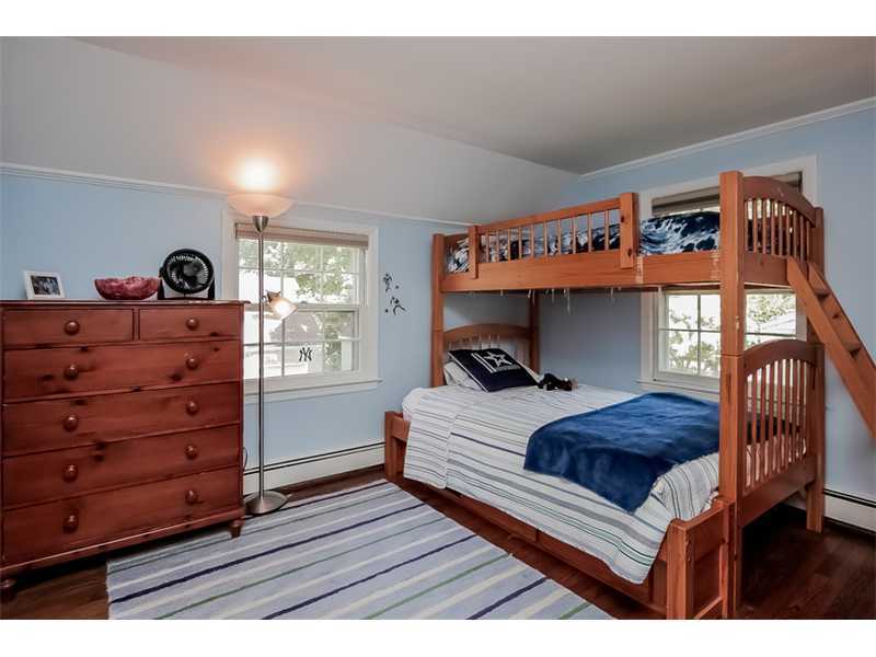 20 Beach Drive Darien, CT 06820 - Photo 19 of 25 a bedroom with a bed and with windows