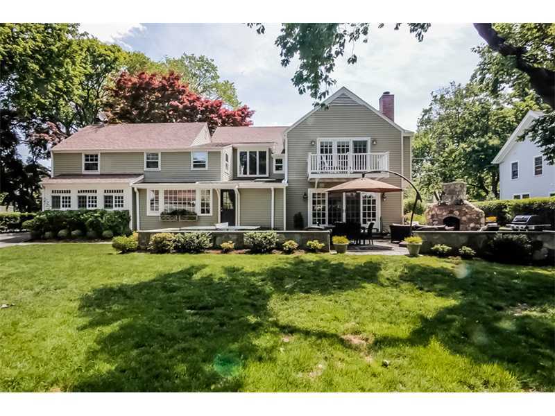 20 Beach Drive Darien, CT 06820 - Photo 21 of 25 a front view of a residential houses with yard and green space