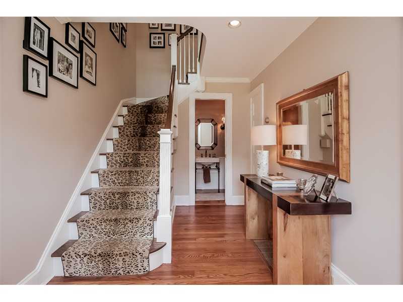 20 Beach Drive Darien, CT 06820 - Photo 3 of 25 a view of a hallway with wooden floor and stairs