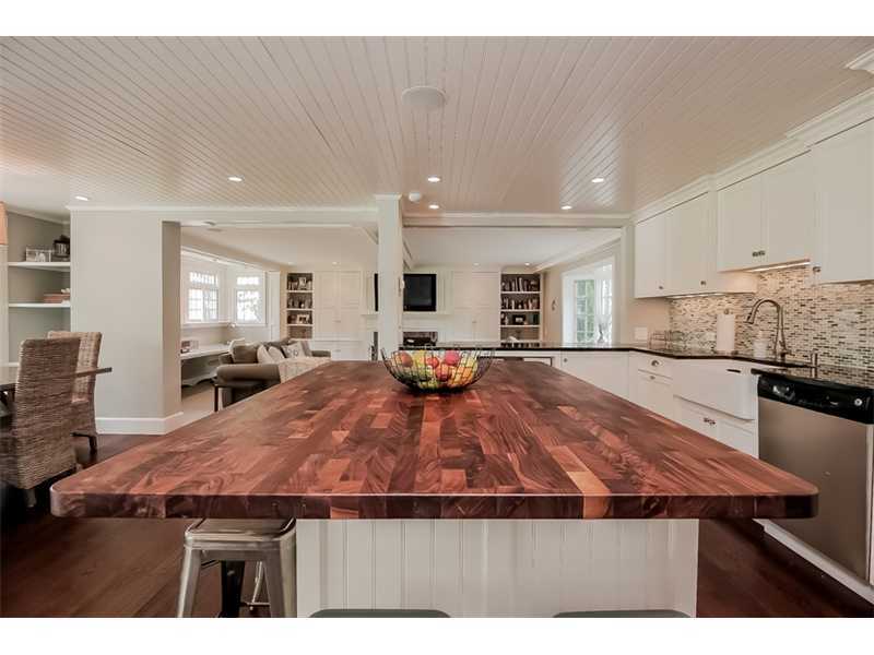 20 Beach Drive Darien, CT 06820 - Photo 9 of 25 a open kitchen with kitchen island a stove and a sink
