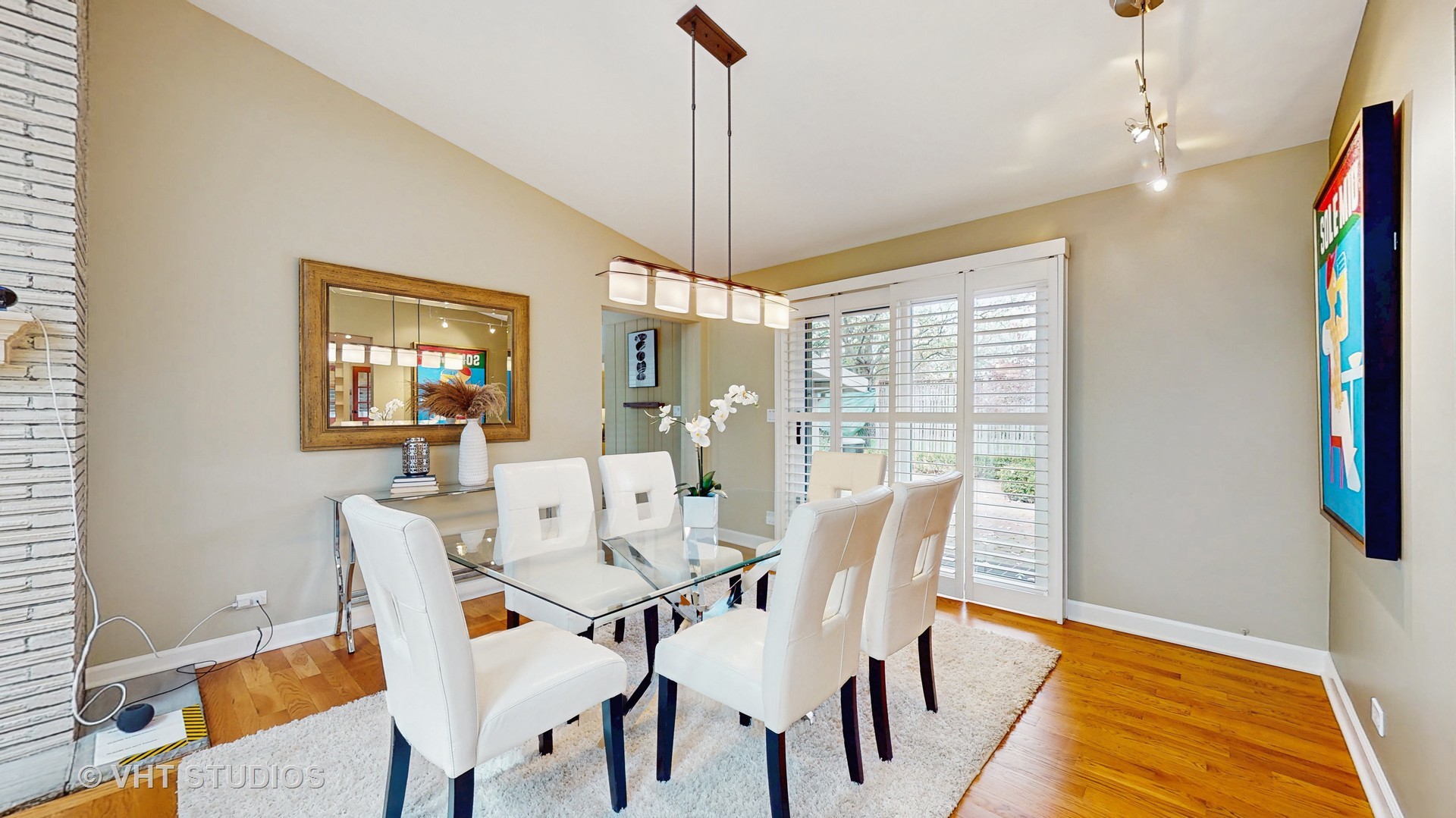 1321 Sheridan Road Wilmette, IL 60091 - Photo 11 of 36 a dining room with furniture a chandelier and wooden floor
