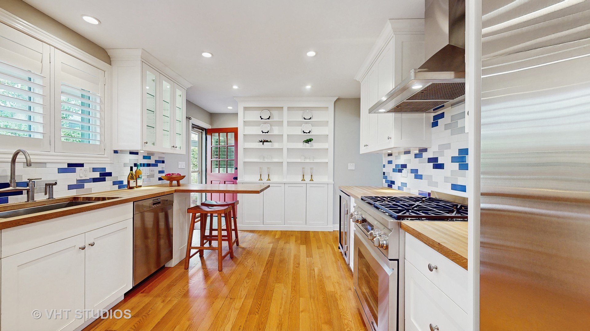1321 Sheridan Road Wilmette, IL 60091 - Photo 14 of 36 a kitchen with stainless steel appliances kitchen island granite countertop a stove a sink and a refrigerator
