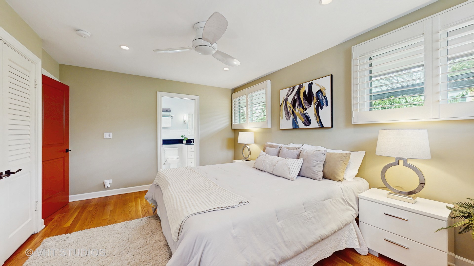 1321 Sheridan Road Wilmette, IL 60091 - Photo 18 of 36 a bedroom with a large bed and a chandelier