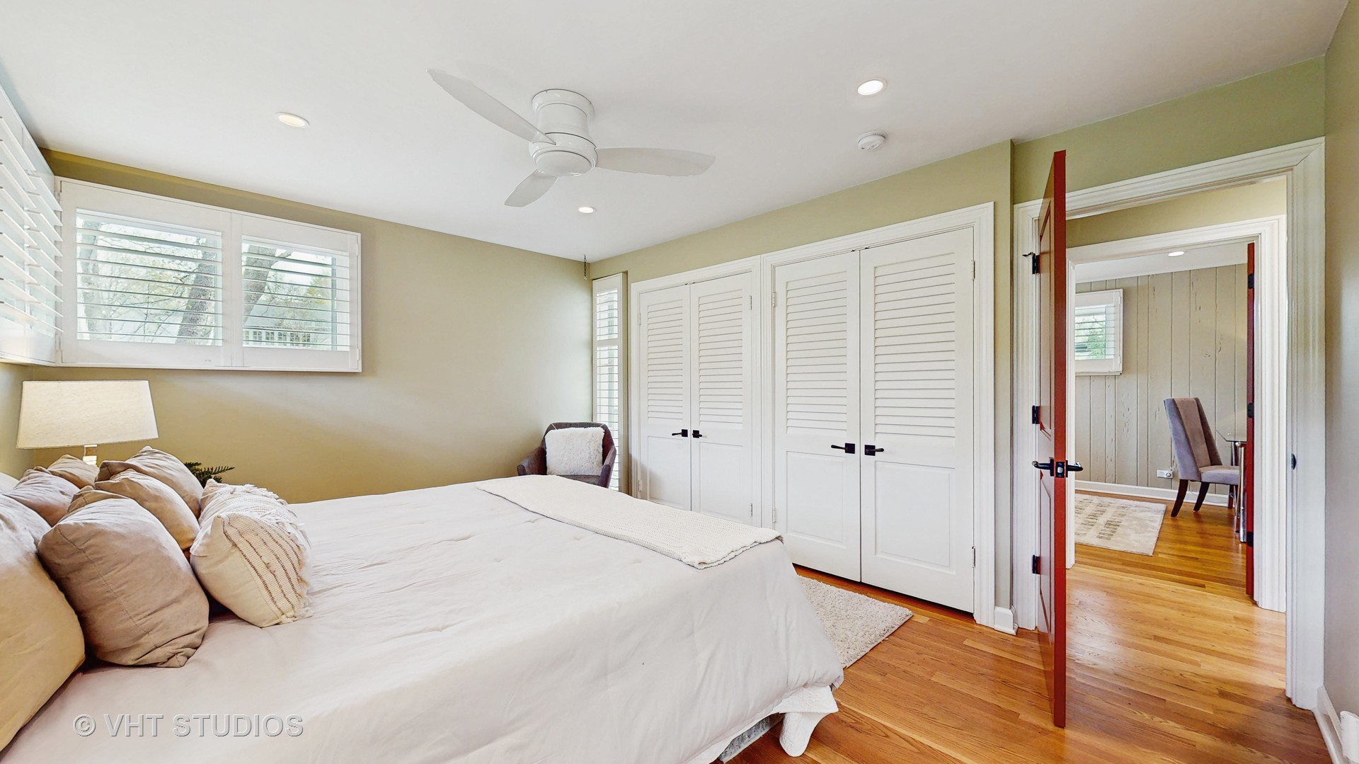 1321 Sheridan Road Wilmette, IL 60091 - Photo 19 of 36 a bedroom with a large bed and a chandelier