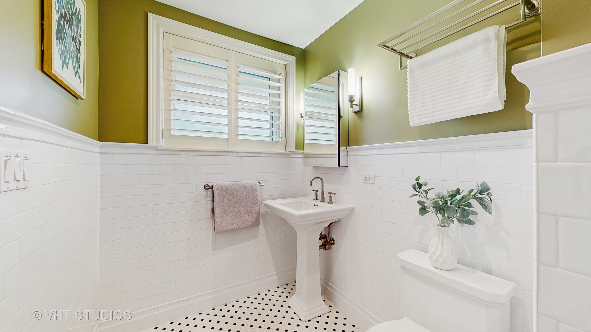 1321 Sheridan Road Wilmette, IL 60091 - Photo 25 of 36 a bathroom with a sink a toilet and a window