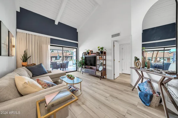a living room with furniture and a flat screen tv