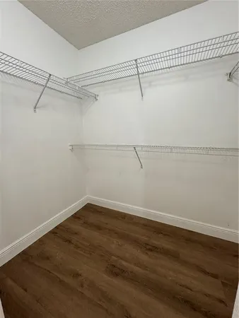 a view of a room with racks on the wall