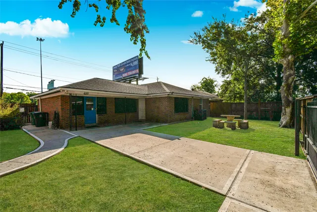 a view of a house with a backyard porch and sitting area