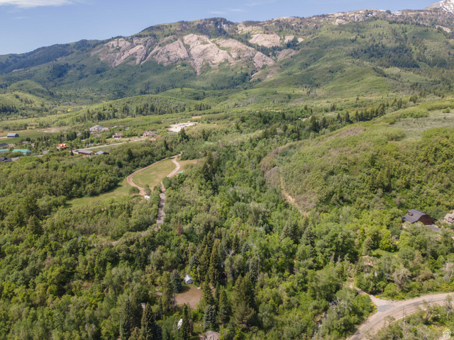 6449 North North Fork Road Eden, UT 84310 - Photo 29 of 38 Expansive mountain landscape featuring abundant green foliage and distant rock formations