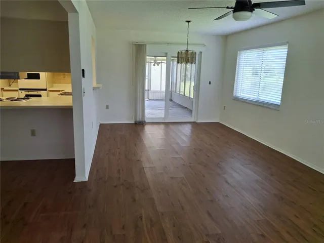 a view of an empty room with windows