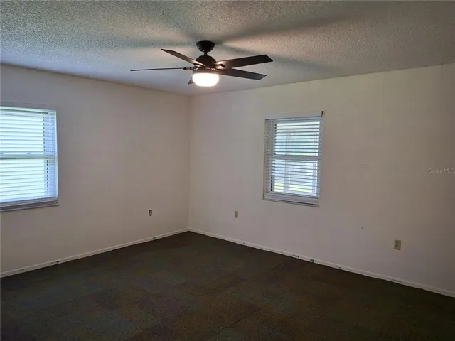a room with gym equipment and a window