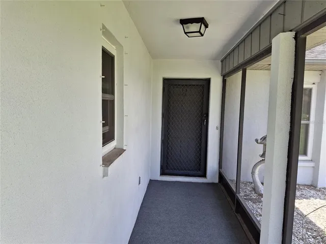 a view of hallway with windows