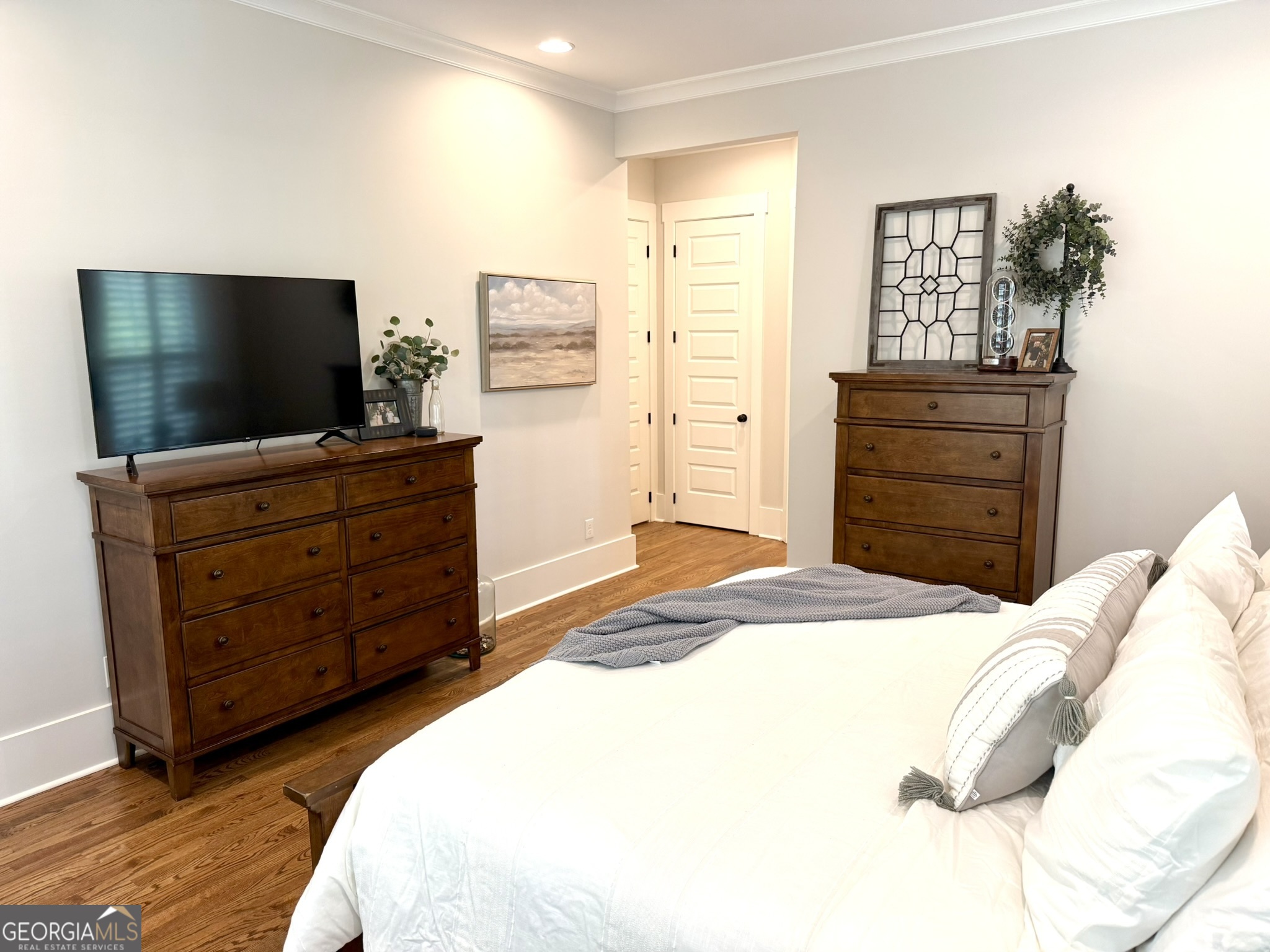 120 Spring Creek Drive Rutledge, GA 30663 - Photo 19 of 38 a bedroom with a bed and flat screen tv