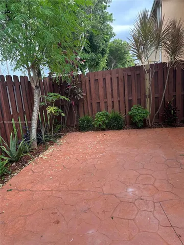 a view of outdoor space with wooden fence