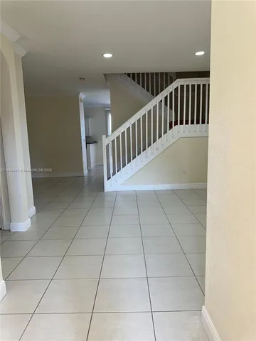 a view of entryway with stairs