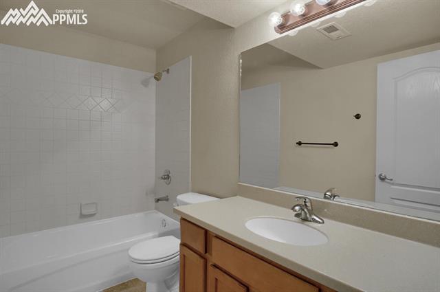 9162 Rockingham Drive Peyton, CO 80831 - Photo 27 of 35 Lower level bath with new solid surface counters.
