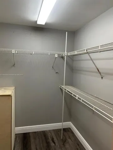 a view of a room with racks on the wall