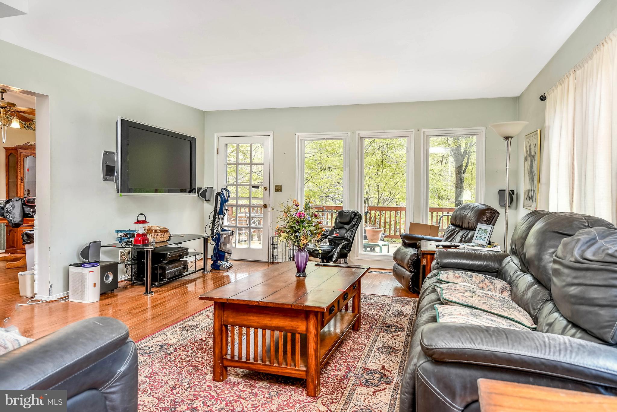 7809 Lake Drive Manassas, VA 20111 - Photo 11 of 44 a living room with furniture and a flat screen tv