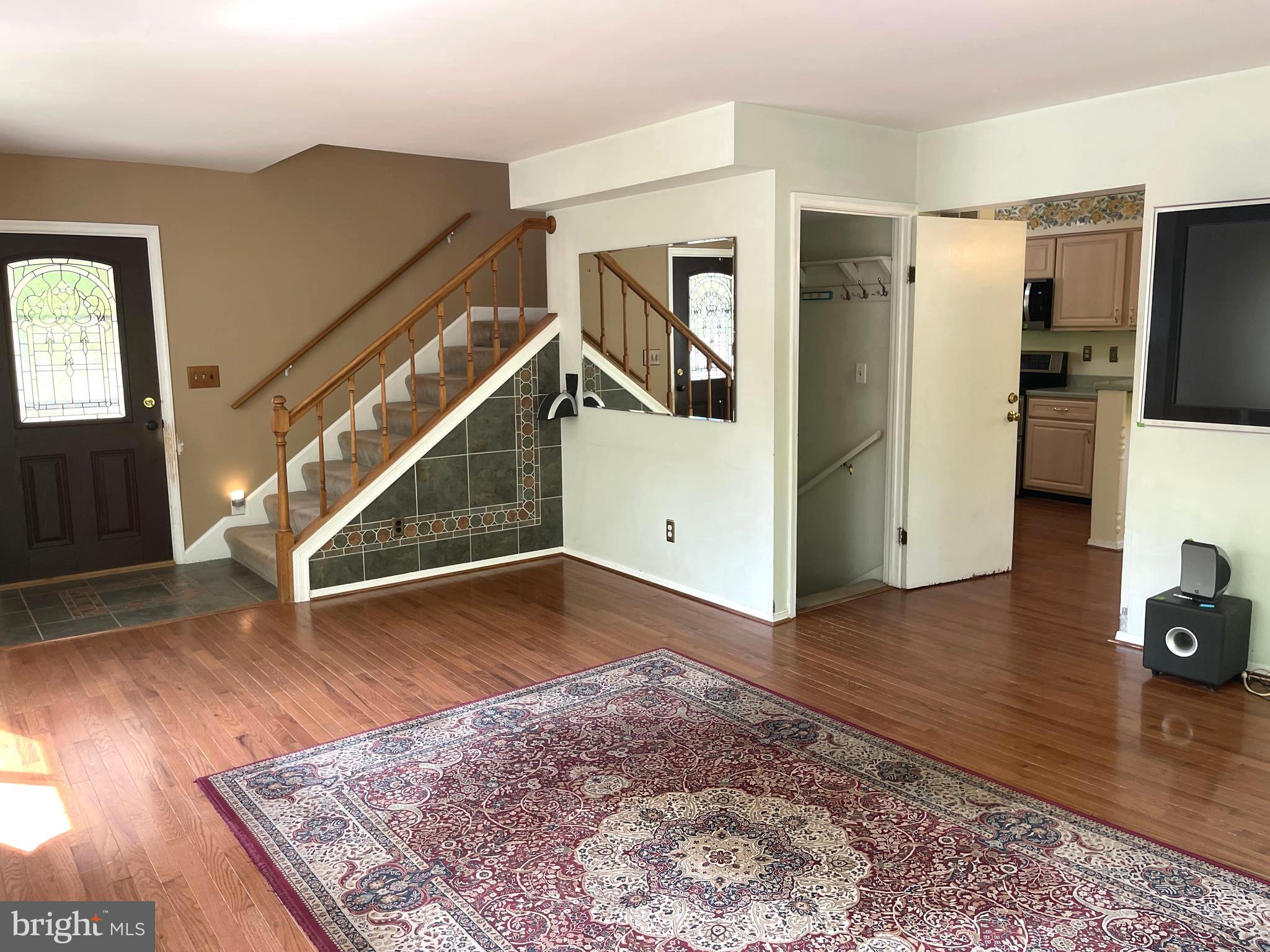 7809 Lake Drive Manassas, VA 20111 - Photo 13 of 44 a view of a livingroom with kitchen and furniture