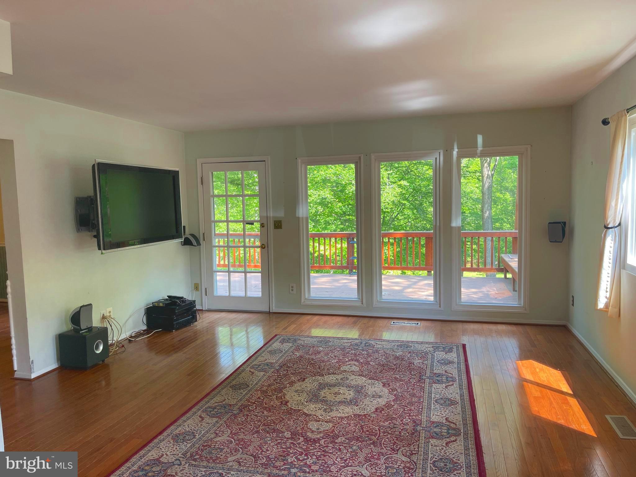 7809 Lake Drive Manassas, VA 20111 - Photo 14 of 44 a living room with furniture and a flat screen tv