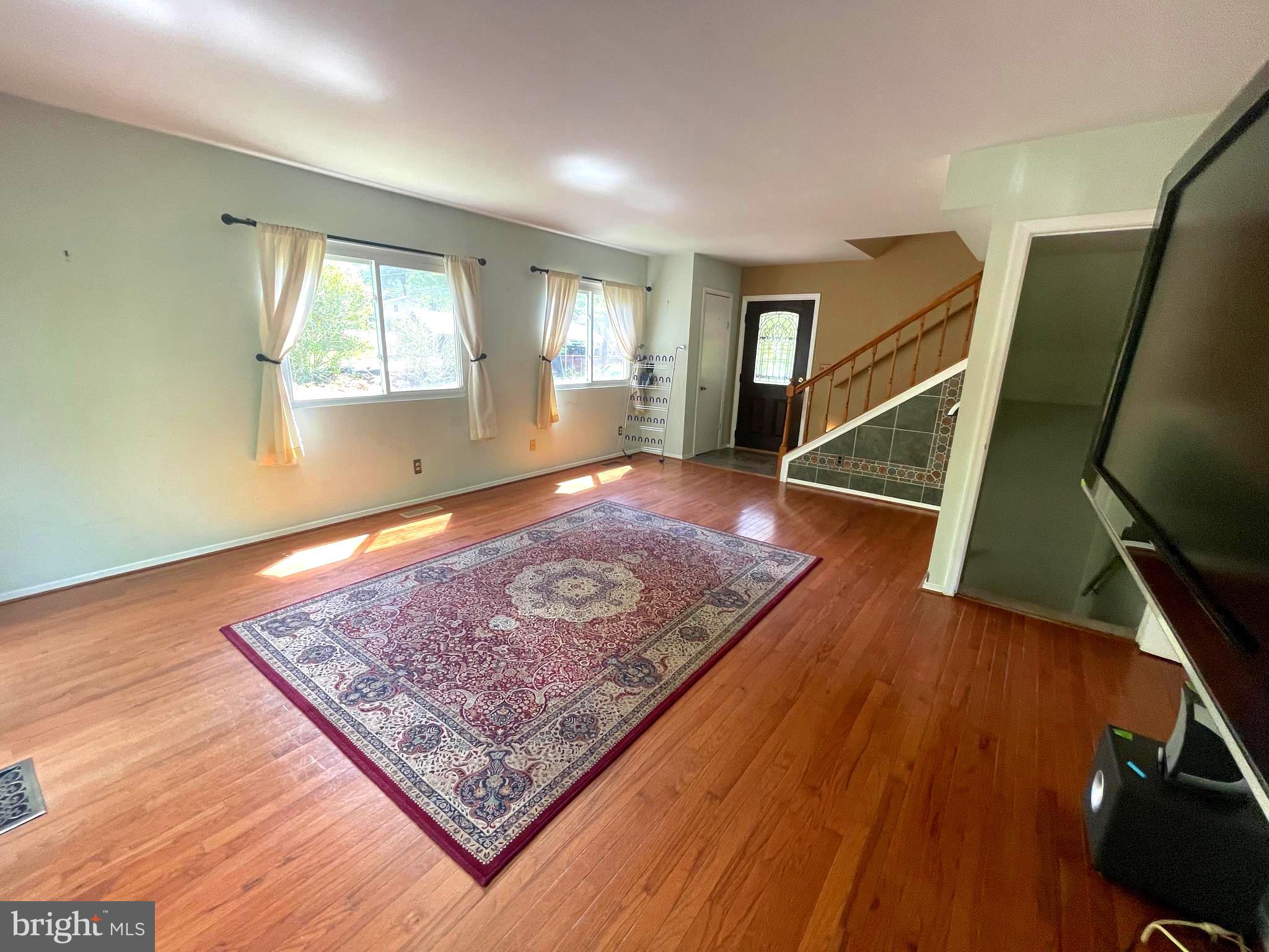 7809 Lake Drive Manassas, VA 20111 - Photo 15 of 44 a view of an empty room and wooden floor