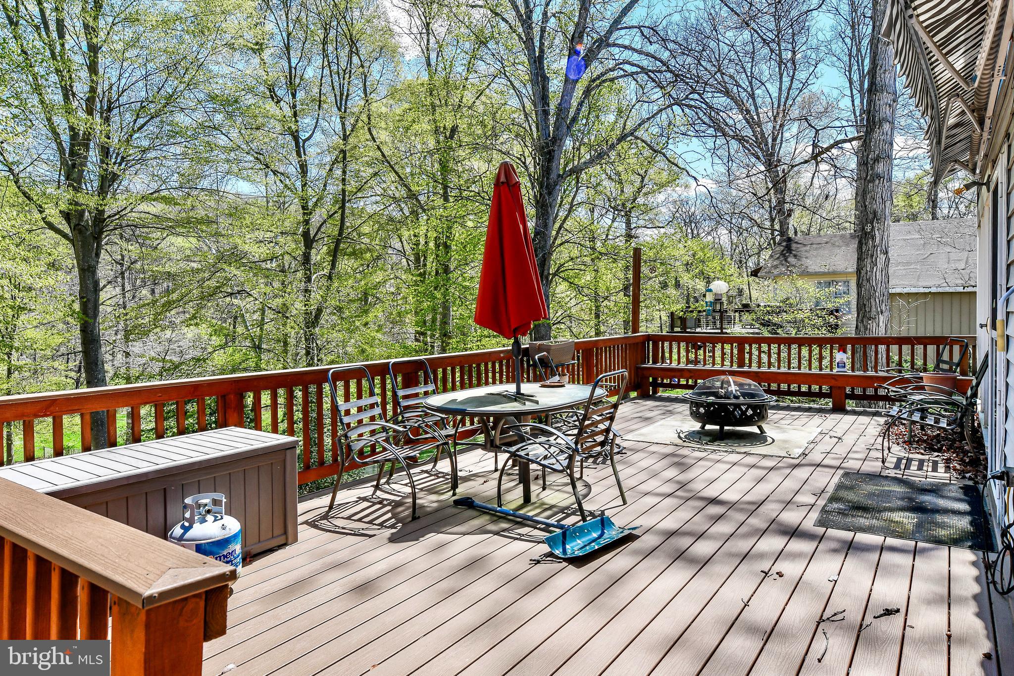 7809 Lake Drive Manassas, VA 20111 - Photo 17 of 44 a view of a deck with wooden floor and outdoor seating