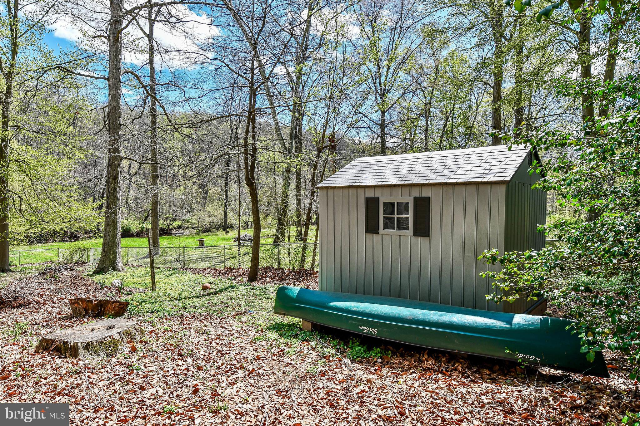 7809 Lake Drive Manassas, VA 20111 - Photo 23 of 44 a view of a house with a backyard and a tree