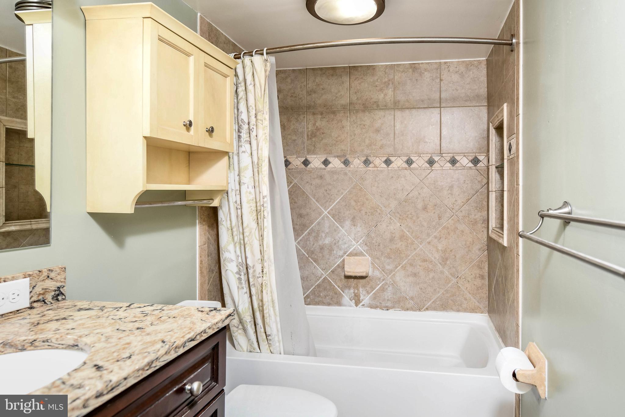 7809 Lake Drive Manassas, VA 20111 - Photo 31 of 44 a bathroom with a granite countertop sink and a mirror