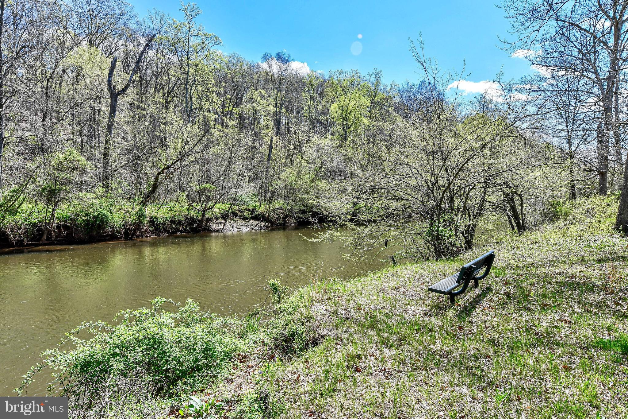 7809 Lake Drive Manassas, VA 20111 - Photo 39 of 44 a view of a lake with a yard