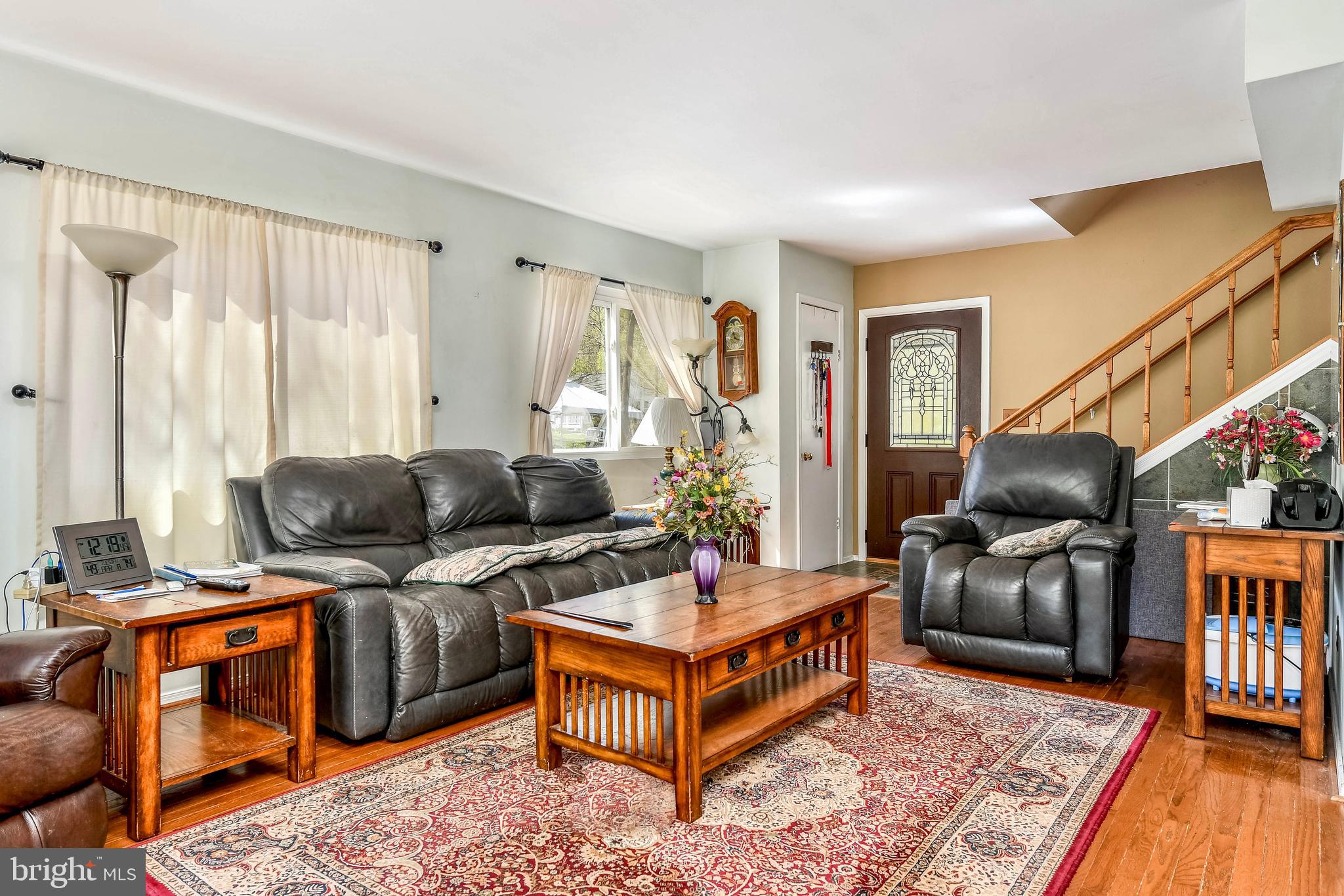 7809 Lake Drive Manassas, VA 20111 - Photo 10 of 44 a living room with furniture and a flat screen tv