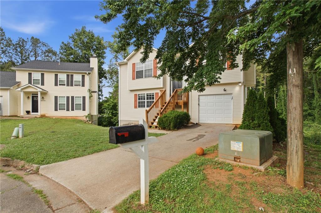 5855 Crescent Ridge Court Lithonia, GA 30058 - Photo 2 of 46 front view of a house with a yard
