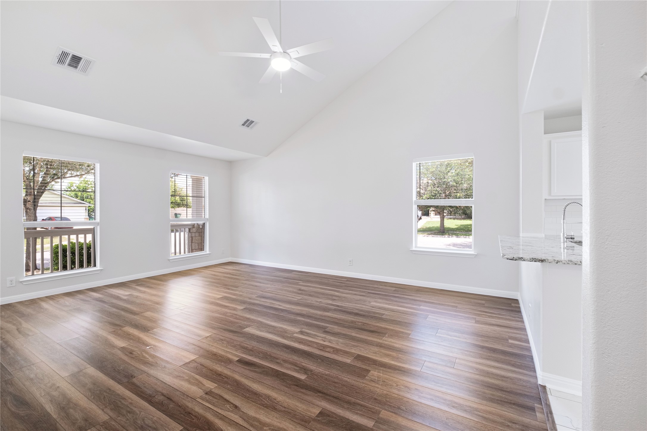 1400 Portchester Castle Path Pflugerville, TX 78660 - Photo 11 of 40 Spare room with lofted ceiling, dark wood finished floors, and ceiling fan