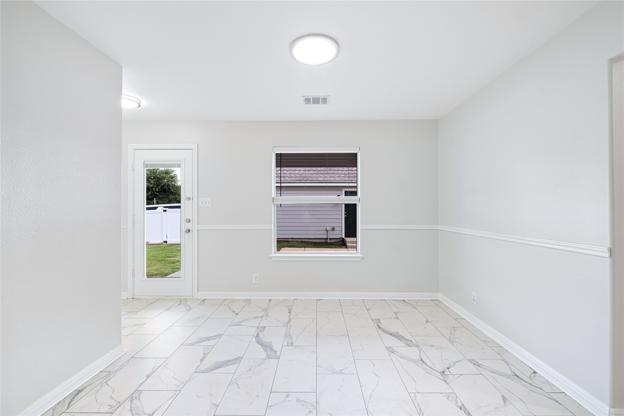 1400 Portchester Castle Path Pflugerville, TX 78660 - Photo 16 of 40 Unfurnished room featuring baseboards and light marble finish floors