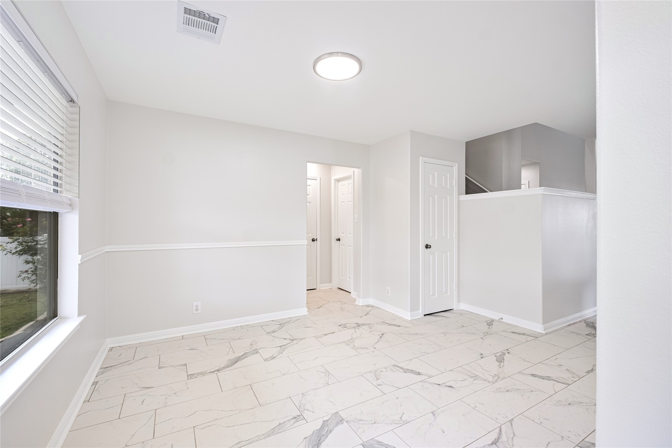 1400 Portchester Castle Path Pflugerville, TX 78660 - Photo 18 of 40 Unfurnished room with light marble finish flooring and baseboards