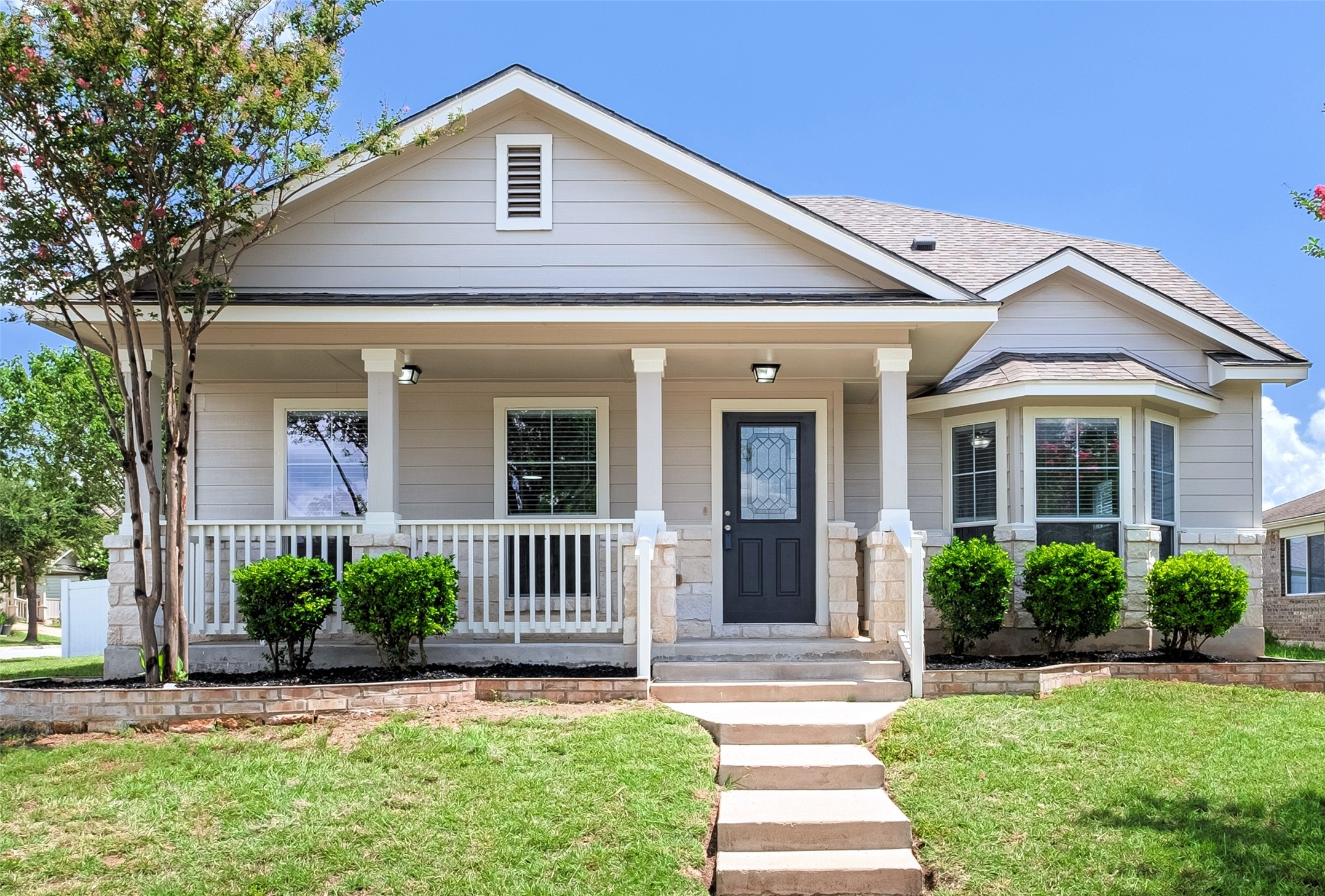 1400 Portchester Castle Path Pflugerville, TX 78660 - Photo 2 of 40 View of front of home with a front yard, a porch, and roof with shingles