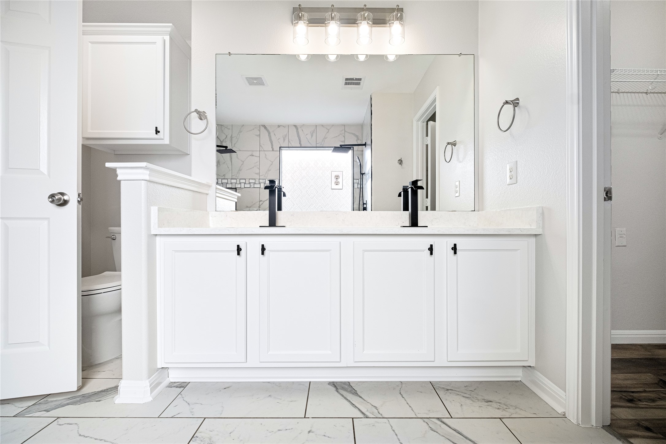 1400 Portchester Castle Path Pflugerville, TX 78660 - Photo 25 of 40 Full bath featuring light marble finish floors, walk in shower, double vanity, and a spacious closet