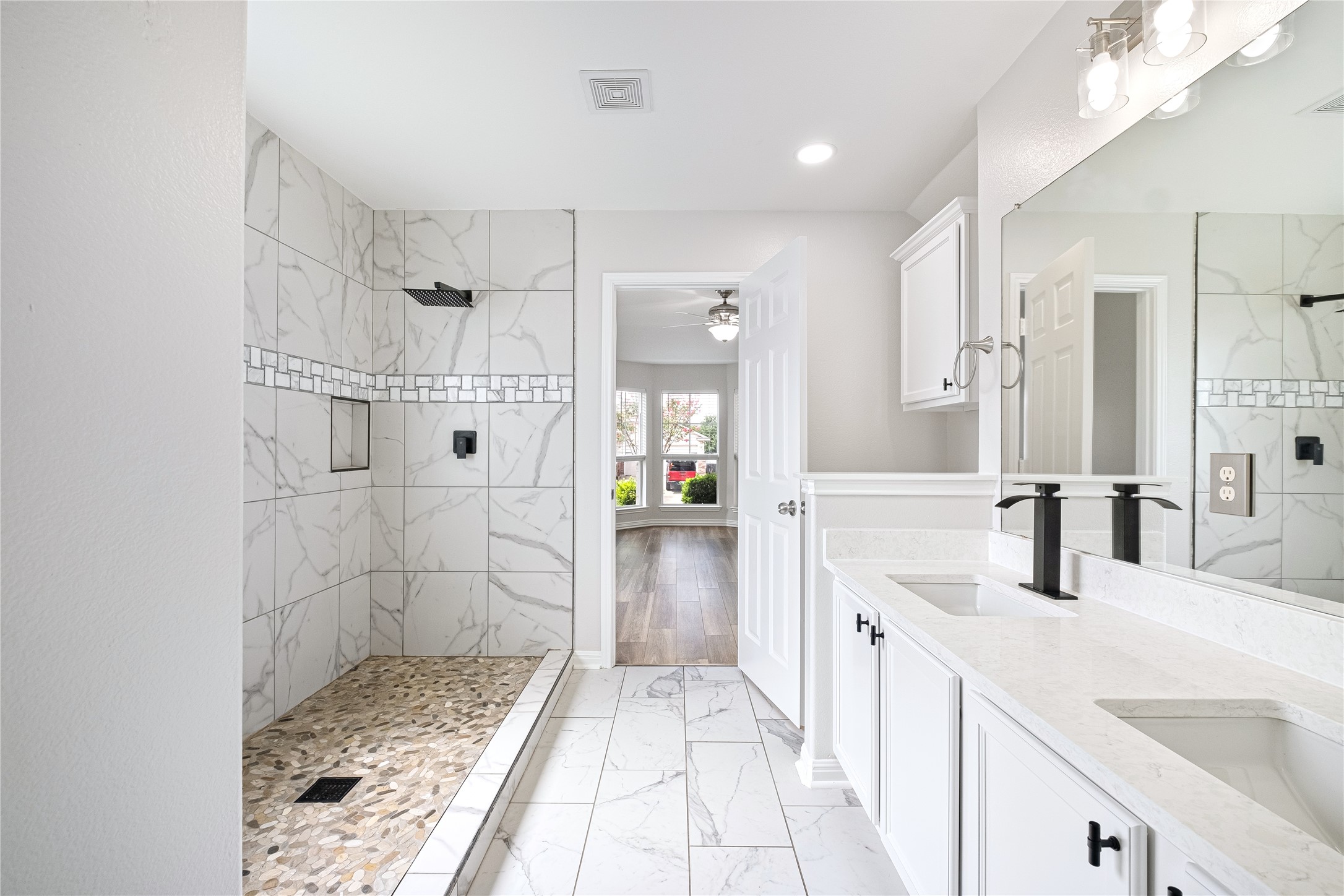 1400 Portchester Castle Path Pflugerville, TX 78660 - Photo 26 of 40 Bathroom with a marble finish shower, light marble finish floors, double vanity, ceiling fan, and recessed lighting