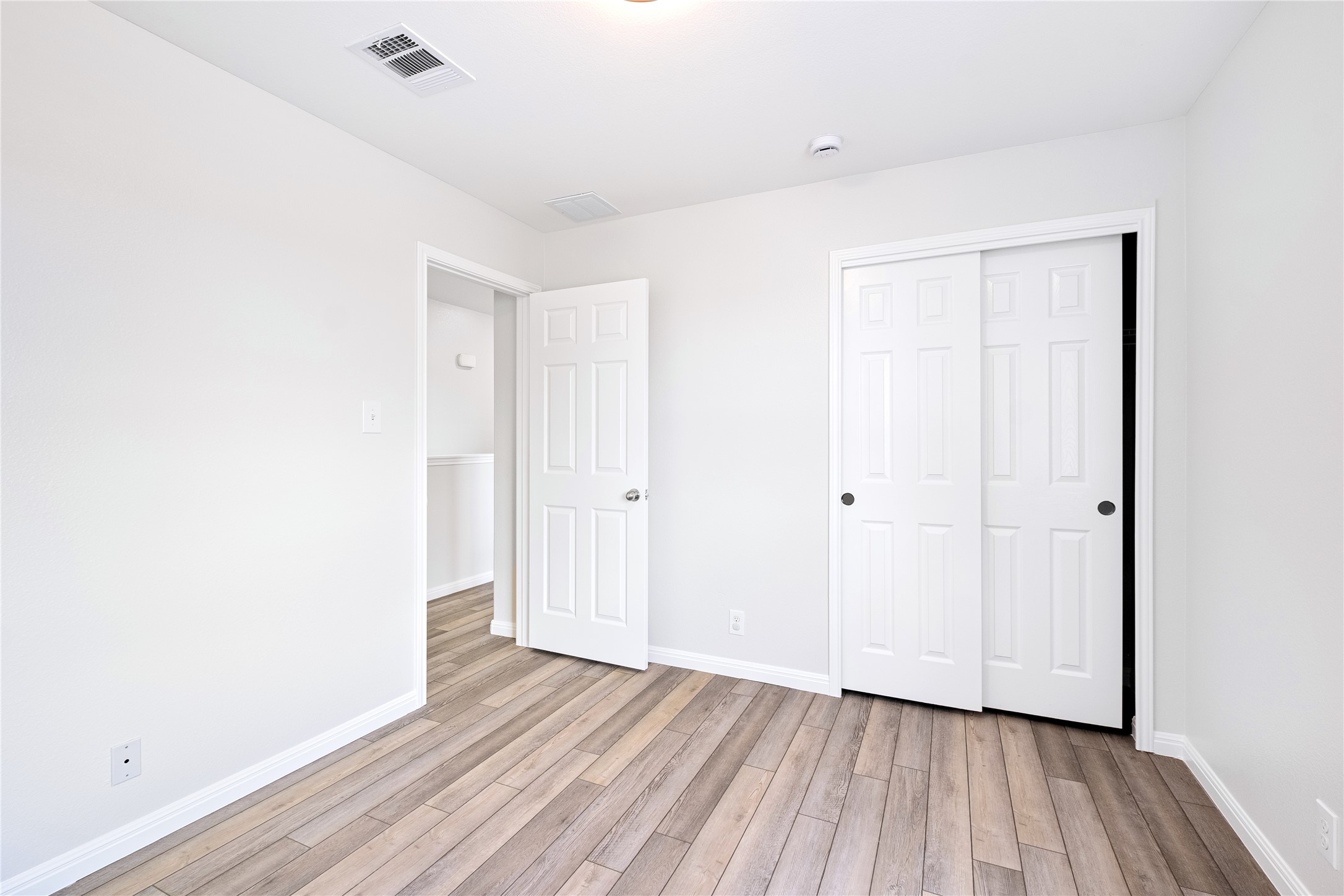 1400 Portchester Castle Path Pflugerville, TX 78660 - Photo 27 of 40 Unfurnished bedroom with light wood finished floors and a closet