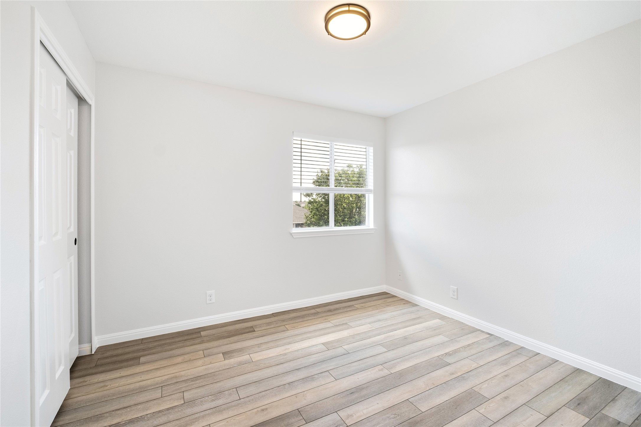 1400 Portchester Castle Path Pflugerville, TX 78660 - Photo 28 of 40 Unfurnished bedroom featuring a closet and light wood-style flooring