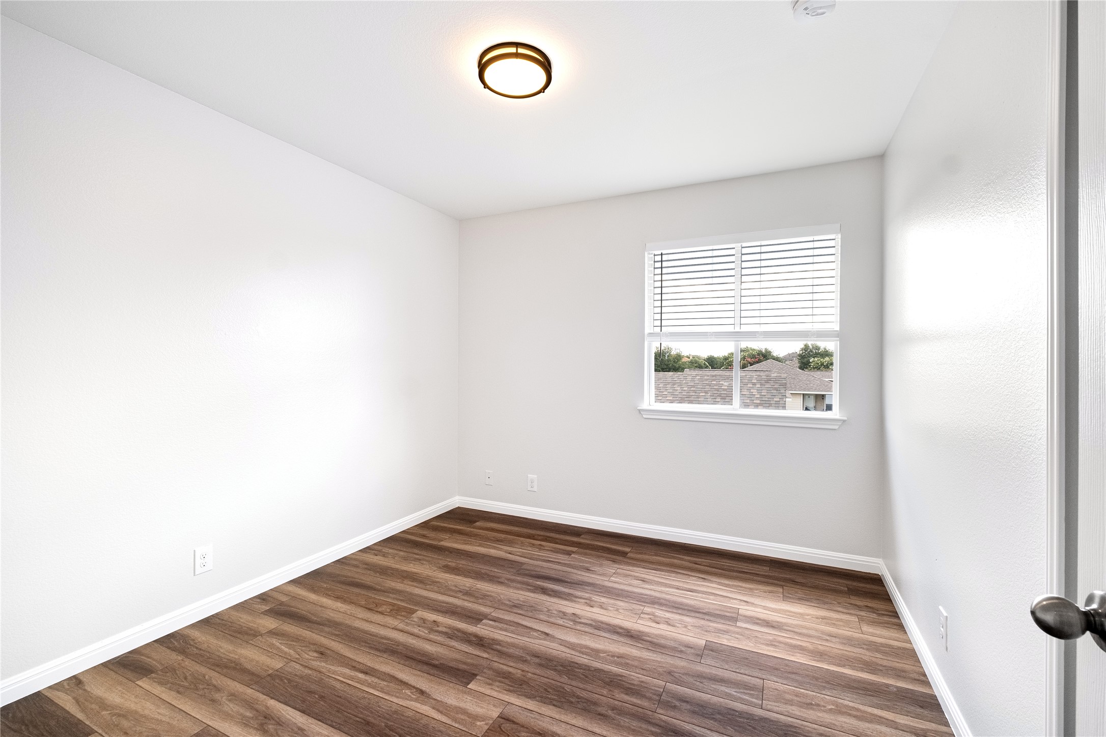 1400 Portchester Castle Path Pflugerville, TX 78660 - Photo 31 of 40 Empty room with dark wood-style floors and baseboards