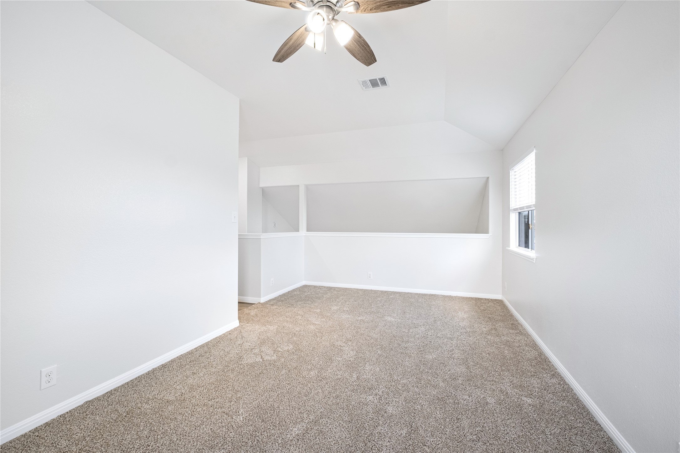 1400 Portchester Castle Path Pflugerville, TX 78660 - Photo 32 of 40 Additional living space featuring vaulted ceiling, carpet floors, and ceiling fan