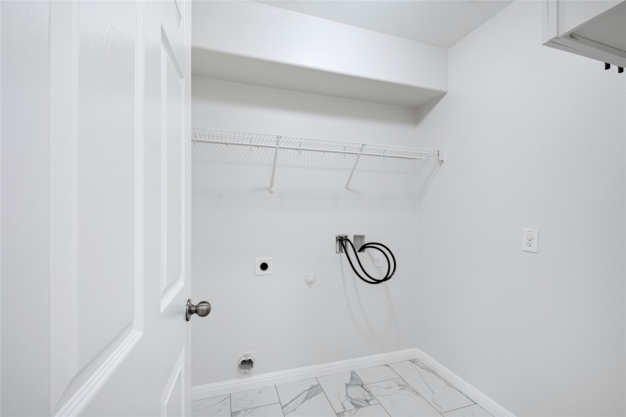 1400 Portchester Castle Path Pflugerville, TX 78660 - Photo 35 of 40 Laundry room with hookup for a gas dryer, hookup for an electric dryer, hookup for a washing machine, and light marble finish floors