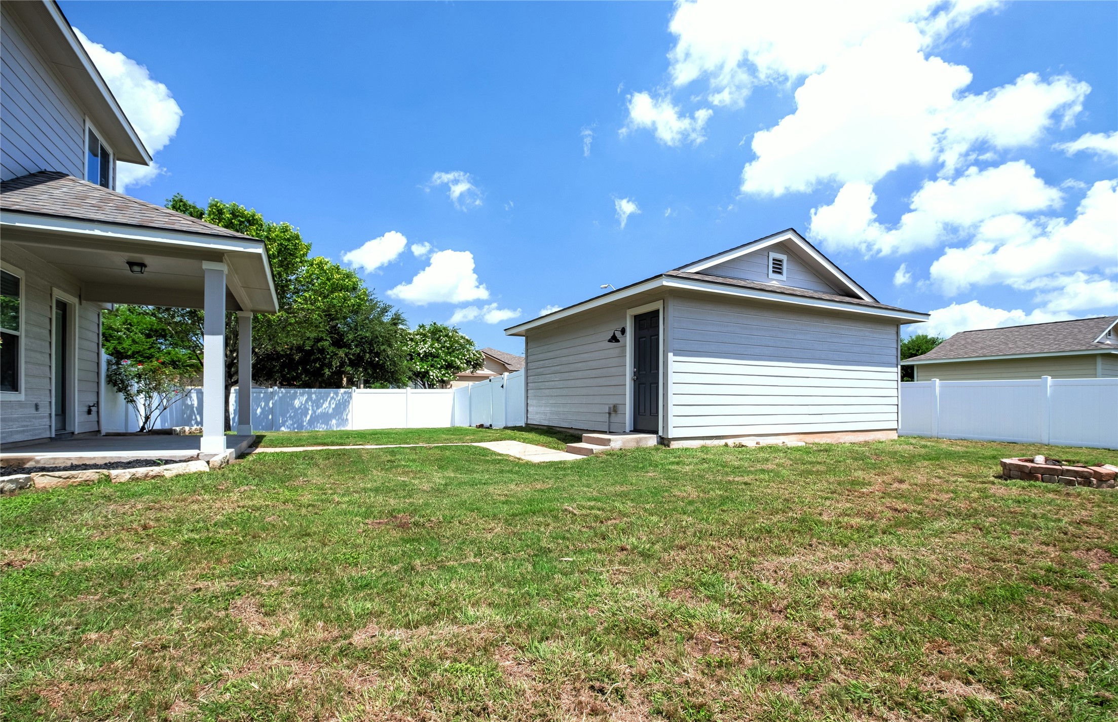 1400 Portchester Castle Path Pflugerville, TX 78660 - Photo 38 of 40 Fenced backyard featuring an outdoor structure and a patio area