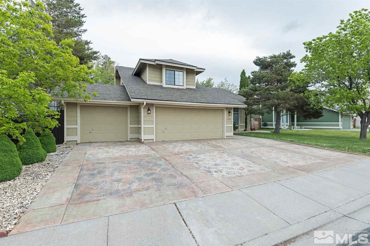 1868 Quail Run Road Reno, NV 89523 - Photo 1 of 1 a front view of a house with a garden