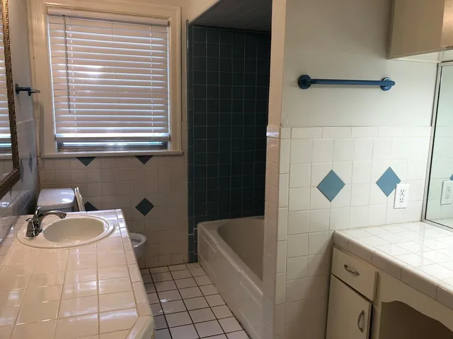 a bathroom with a sink and a bathtub