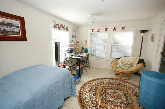 a bedroom with furniture and a bed