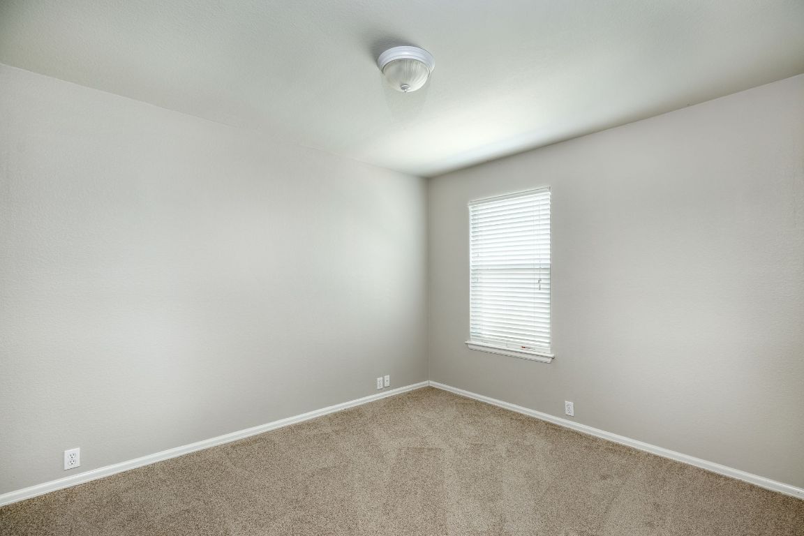 409 Lark Street Leander, TX 78641 - Photo 11 of 14 an empty room with windows